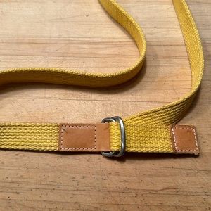 Woven yellow cotton belt with leather tabs